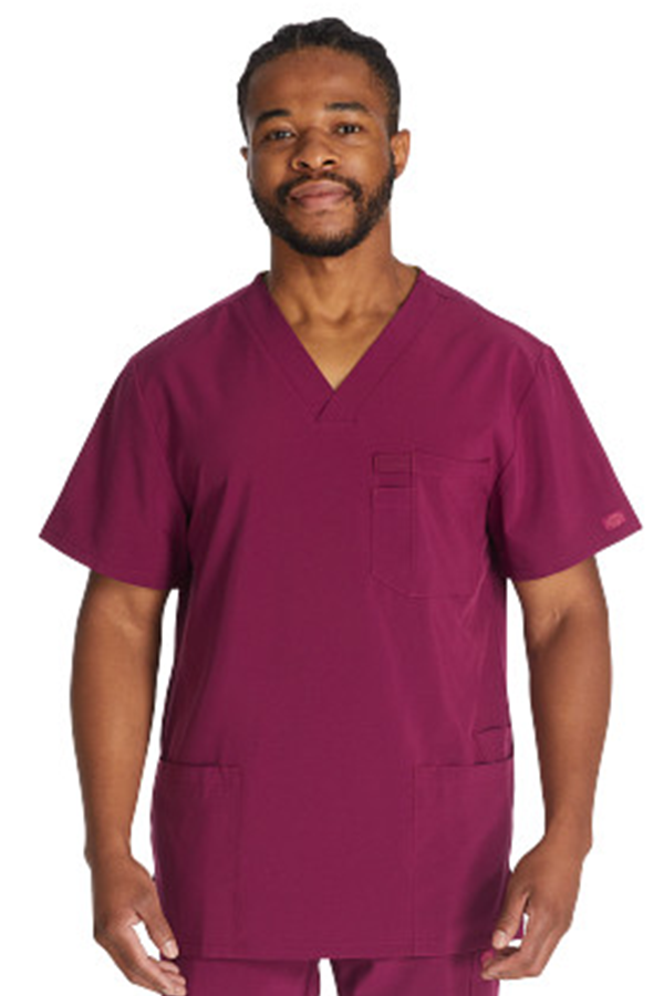 Stay comfortable and professional in the Dickies DK645 Men’s Scrub Top with 4 pockets, stretch fabric, and modern fit.